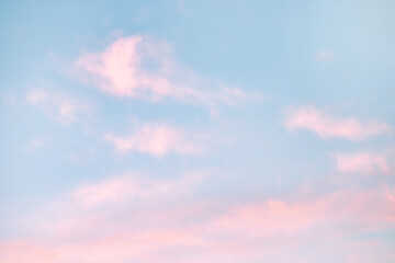 Wall Mural - a beautiful sky tinted by the sun leaving vibrant shades of gold, pink, blue and multicolored. cloud