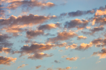 Wall Mural - a beautiful sky tinted by the sun leaving vibrant shades of gold, pink, blue and multicolored. cloud