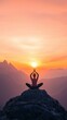 © vuang - Woman meditating at sunset
