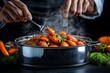 © Thanyarat - Chef testing the tenderness of parboiled carrots with a fork, in front of a steaming pot