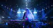 © Gorodenkoff - Female DJ Delivers a Live Performance of Electronic Music while Standing Behind Turntable Decks at a Massive Concert. Dance Beats Play at an EDM Concert with Falling Confetti. Footage from the Back