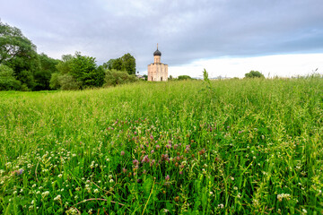 Wall Mural - Church of Intercession upon Nerl River 12th century. (Bogolyubovo, Vladimir region, Golden Ring of Russia) A warm summer evening. historical and cultural heritage of Russia.