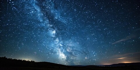 Wall Mural - an endless expanse of twinkling stars against a dark blue-black background, with the occasional flas