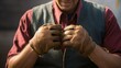 ©   - Hands of a Craftsman: Close-up of weathered hands adjusting leather gloves, showcasing the skill and dedication of a skilled craftsman.
