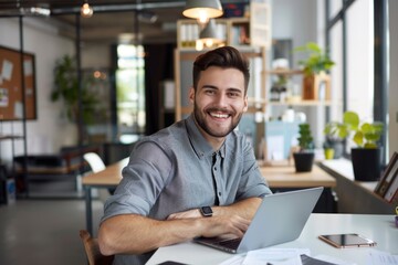 Poster - a person sitting at a desk with a laptop, perfect for illustrations and presentations