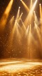 © Shyamal - Brilliant golden stage lights highlighting the stage with powerful illumination.