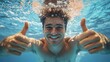© Vii - A person swimming underwater with a thumbs up gesture, great for motivational or inspirational themes