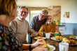 © Marko Geber - Group of senior friends enjoying breakfast together at home