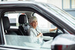 © Davor - Senior businesswoman driving a car