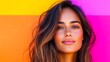 © Vertigo Images - Young woman with long brown hair against a colorful background.