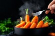 © Thanyarat - Chef testing the tenderness of parboiled carrots with a fork, in front of a steaming pot