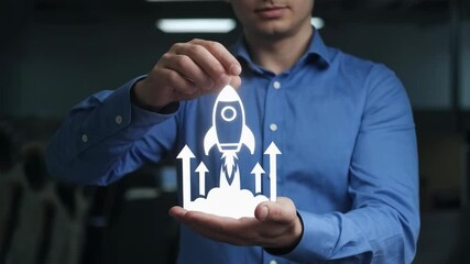 Poster - A man holds a graphic of a rocket, symbolizing innovation and growth in business.
