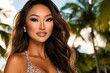 © NatthaphonSiri - Stunning Portrait of a Young Asian Woman with Long Brown Hair, Wearing a Sparkling Dress Against a Tropical Background.