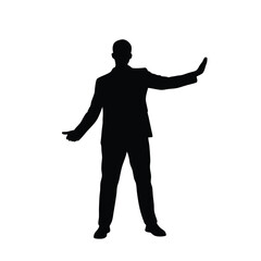 Wall Mural - A man in a suit is standing in front of a white background. He is wearing black shoes and a black jacket