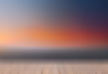 Aufkleber - Blurred sunset over a calm ocean, viewed from a low perspective.  The colors blend softly from cool blues and purples to warm oranges and reds.  A subtle wooden surface is visible in the foreground.