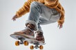 © EdvvinStudios - A young skater performs a trick in a stylish outfit on a skateboard in a bright indoor space