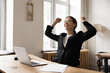 © fizkes - Happy business woman celebrates professional success at workplace with laptop, received positive feedback, recognition from her boss, get promotion or job offer, closed business deal or partnership