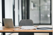 © PRIME STOCK LAB - modern office workspace featuring laptop, documents, and binder on wooden desk. clean design promotes productivity and focus in professional setting