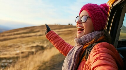 Wall Mural - An excited female tourist was driving alone,  enjoying the freedom of a road trip.   A woman's joy and freedom in autumn shows her love for life and her anticipation  for new adventures.