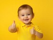 © Bipul Kumar - happy child giving thumbs up on a bright yellow background