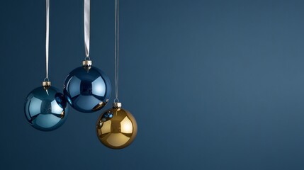 Poster - Three Christmas ornaments hanging from a blue background