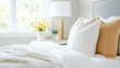 © VERTEX SPACE - Cozy bedroom with neatly made bed featuring white pillows and soft blanket, complemented by stylish lamp and fresh flowers, creating serene atmosphere