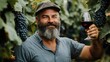 © 69 - Happy Winemaker Holding Red Wine Glass in Vineyard Surrounded by Blue Grapes, Celebrating a Successful Harvest in Beautiful Nature Scenery