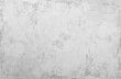 © Sergey - Light gray low contrast texture. Old stained paper wallpaper for design work with copy space.