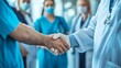 © SHI - Medical workers in protective suits shake hands at the lab
