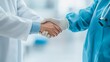 © SHI - Medical workers in protective suits shake hands at the lab