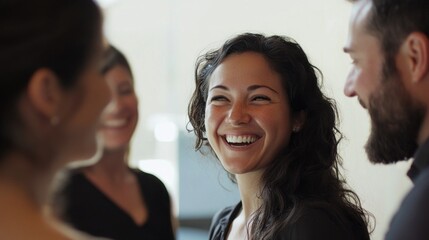 Poster - A woman with a big smile is surrounded by three other people