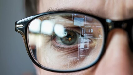 Poster - Close-up of a person's eye reflected in glasses, showcasing digital information.