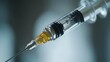 © kenshin - Close-up of a sterile syringe with a needle, ready for injection.