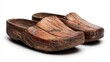 ©  Shomixer - This image captures the charm of a pair of rustic wooden clogs, showing the signs of wear and age. They represent durability, history, and craftsmanship.