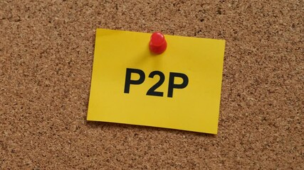 Wall Mural - A yellow adhesive note with the acronym P2P on it pinned to a cork board. Close up.