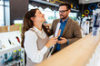 © Dusko - Beautiful and happy middle age couple buying consumer tech products in modern home appliances store. They are choosing beard and hair clipper and hairdryer. People and consumerism concept.