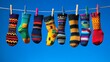 © Freedomstocker - Colorful socks drying in the sun outdoor clothesline photography bright blue sky close-up textile design
