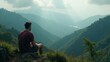 © Andrey - A solitary figure contemplates breathtaking mountain views in the early morning light