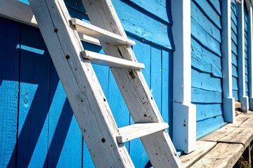 Poster - White Ladder Leaning Against a Bright Blue Wall in a Minimalist Setting, Perfect for Interior Design Inspiration and Home Decor Ideas, Showcasing Textures and Shadows