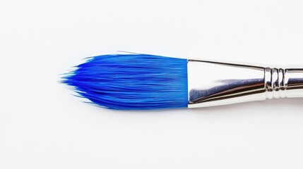 Photo of a blue brush isolated on a white background. Suitable for creative expression artwork.