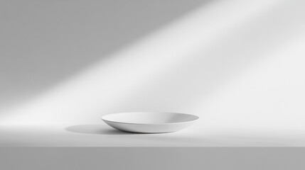 Poster - A minimalist white bowl on a simple surface, illuminated by soft light.