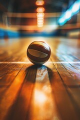 Poster - A basketball ball sits alone on a wooden floor, ideal for use in sports-themed designs or illustrations