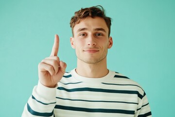 Poster - A person pointing with their index finger in a striped shirt