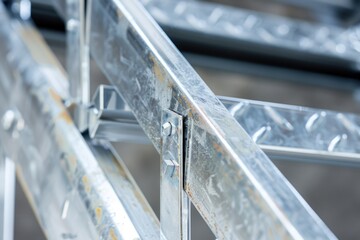 Poster - A detailed view of a metal framework, featuring interlocking metal bars