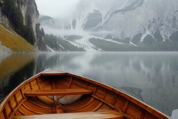 Poster - A wooden boat sailing on a calm lake with mountainous scenery in the background