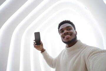 Aufkleber - A person holding their cell phone and taking a selfie, a common practice in today's digital age
