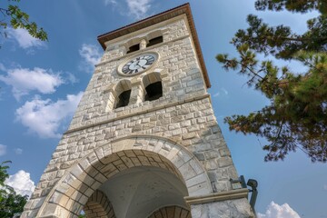 Poster - Tall clock tower against a clear blue sky