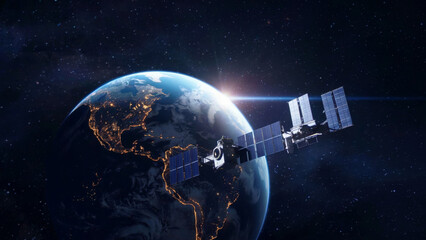 Wall Mural - A satellite orbits Earth with city lights visible..