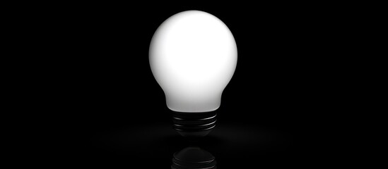 Poster - A single light bulb illuminated against a black background