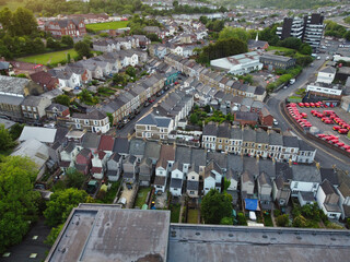 Wall Mural - High Angle View of Newport City on River Usk Wales, United Kingdom During Sunset. Aerial Footage Was Captured with Drone's Camera on May 27th, 2024